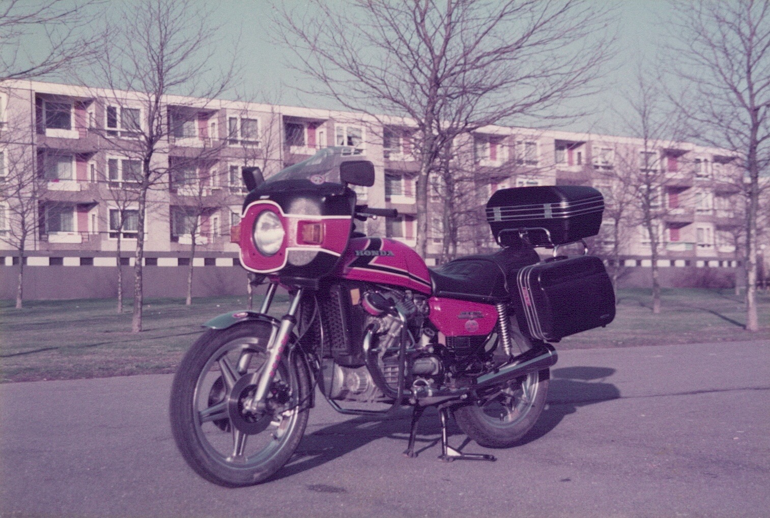 A Honda CX500 with a front fairing and luggage cases in May 1984.