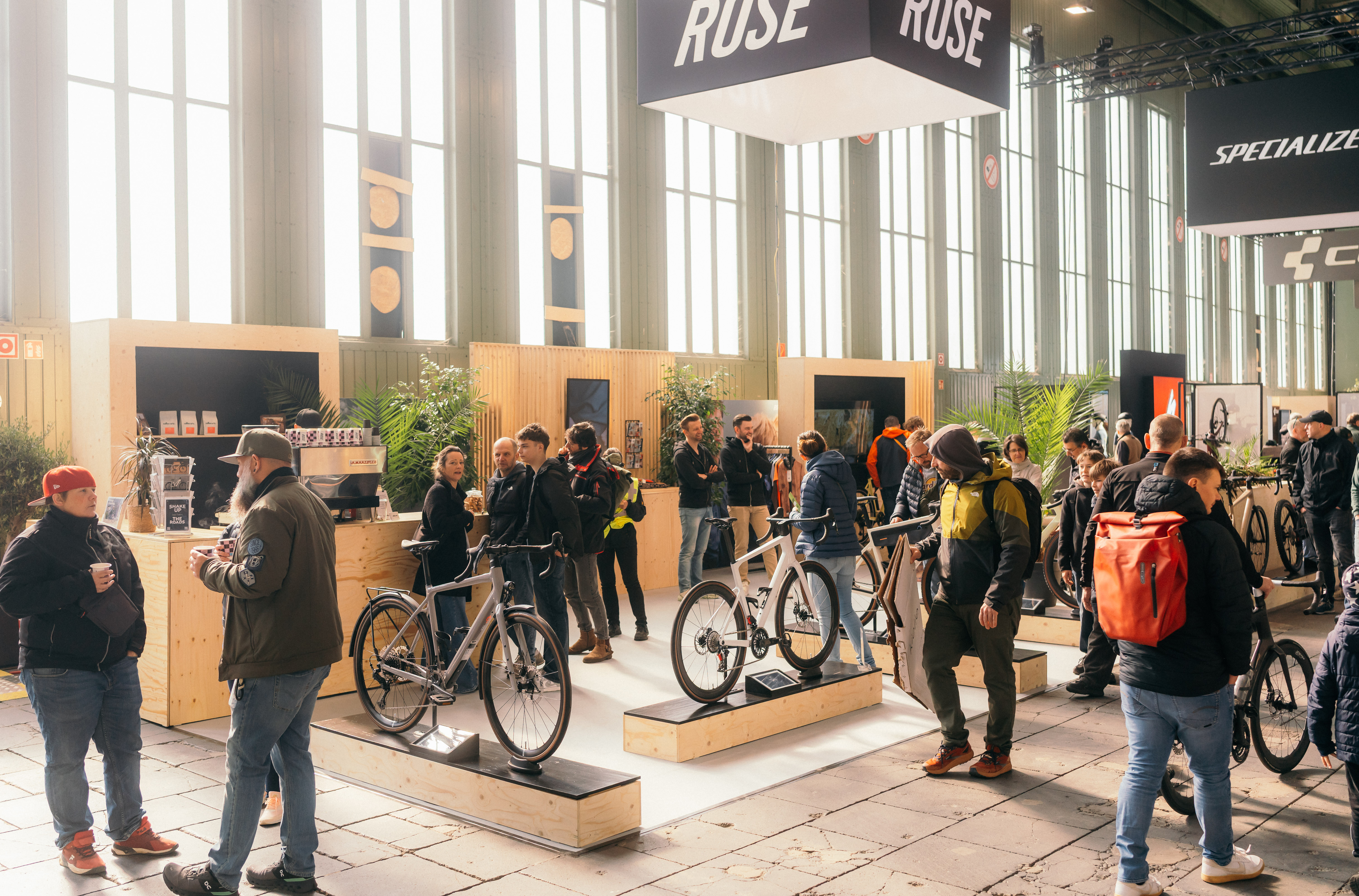 Visitors viewing bicycles inside a VELOBerlin exhibition hall